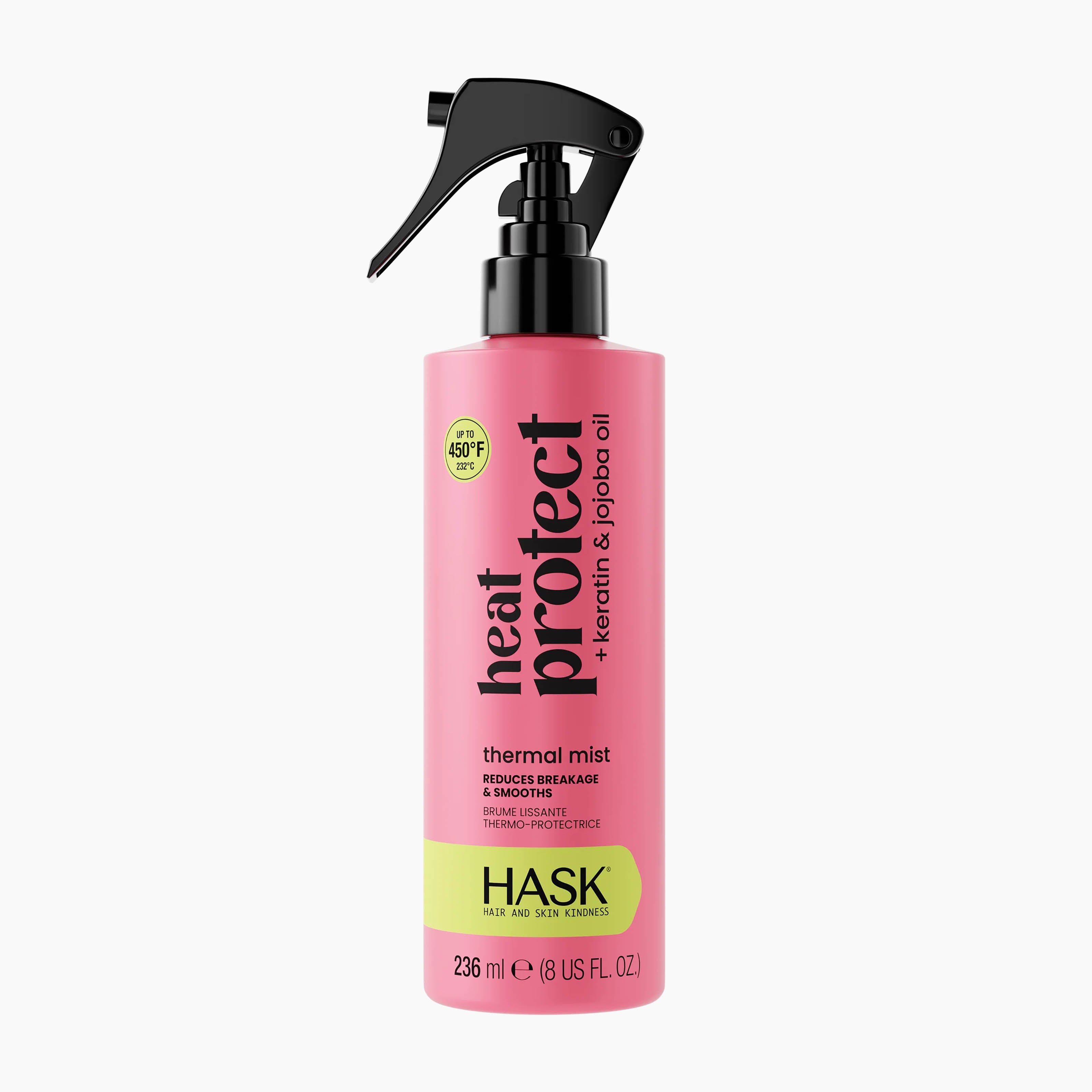 A pink bottle of HASK Heat Protect Thermal Mist with a black spray nozzle and a lime green label band, shown on a clean white background.