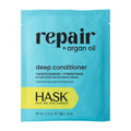 HASK Repair deep conditioner packet with blue and yellow design on a white background