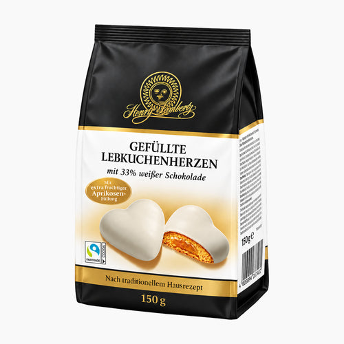A bag of Henry Lambertz Filled Gingerbread Hearts White Chocolate on a light gray background.