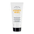 Perlier Honey Daily Protect Hand Cream in a white tube with black and orange text, highlighting the brand and product name.