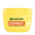 Yellow jar of Garnier Vitamin C Fresh & Bright Hydrating Sorbet Cream on a white background