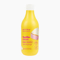 A yellow bottle of INTRA gourmand Vanilla Cream bath and shower gel, featuring a white cap and a cupcake graphic on the label, set against a plain white background.