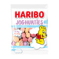 A package of Haribo Joghurties candies, showing the product name, a graphic of a smiling character with fruit properties, and various colored gummy candies visible through the clear plastic packaging.