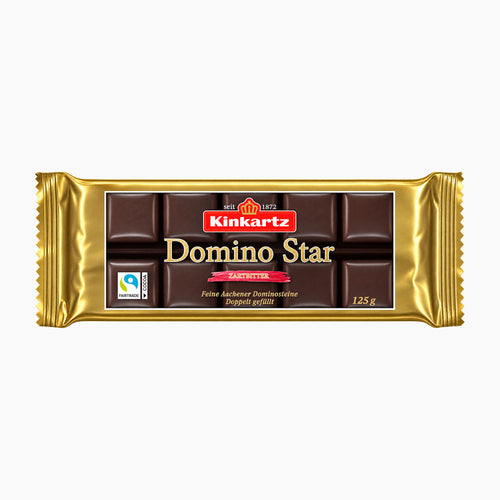 A 125 g bar of Kinkartz Domino Star dark chocolate pralines in its signature gold foil wrapper, shown against a plain white background.
