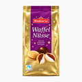 A 250g package of Kinkartz Waffelnüsse (nut shaped wafer shells) on a clean white background. The packaging is metallic gold with a purple central panel featuring the red Kinkartz logo and white text.