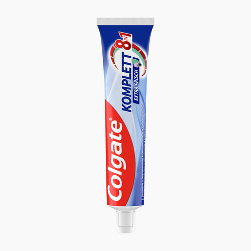 A tube of Colgate Komplett 8in1 Extra Fresh toothpaste on a light gray background.