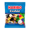 A package of Haribo Konfekt licorice confectionery featuring various flavors such as coconut, cocoa, caramel, and fruit. The package is colorful with an image of a parrot and text detailing the product name and flavors.