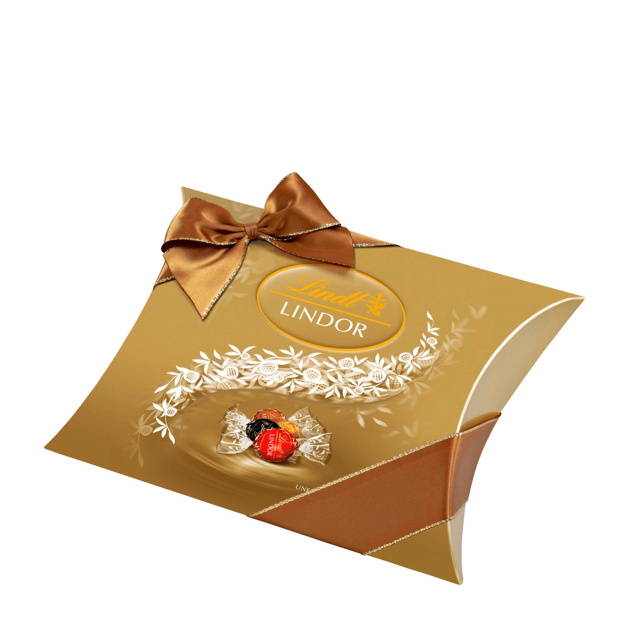 A gold-colored Lindt Lindor pillow pack with assorted chocolate balls, featuring a bow on top.
