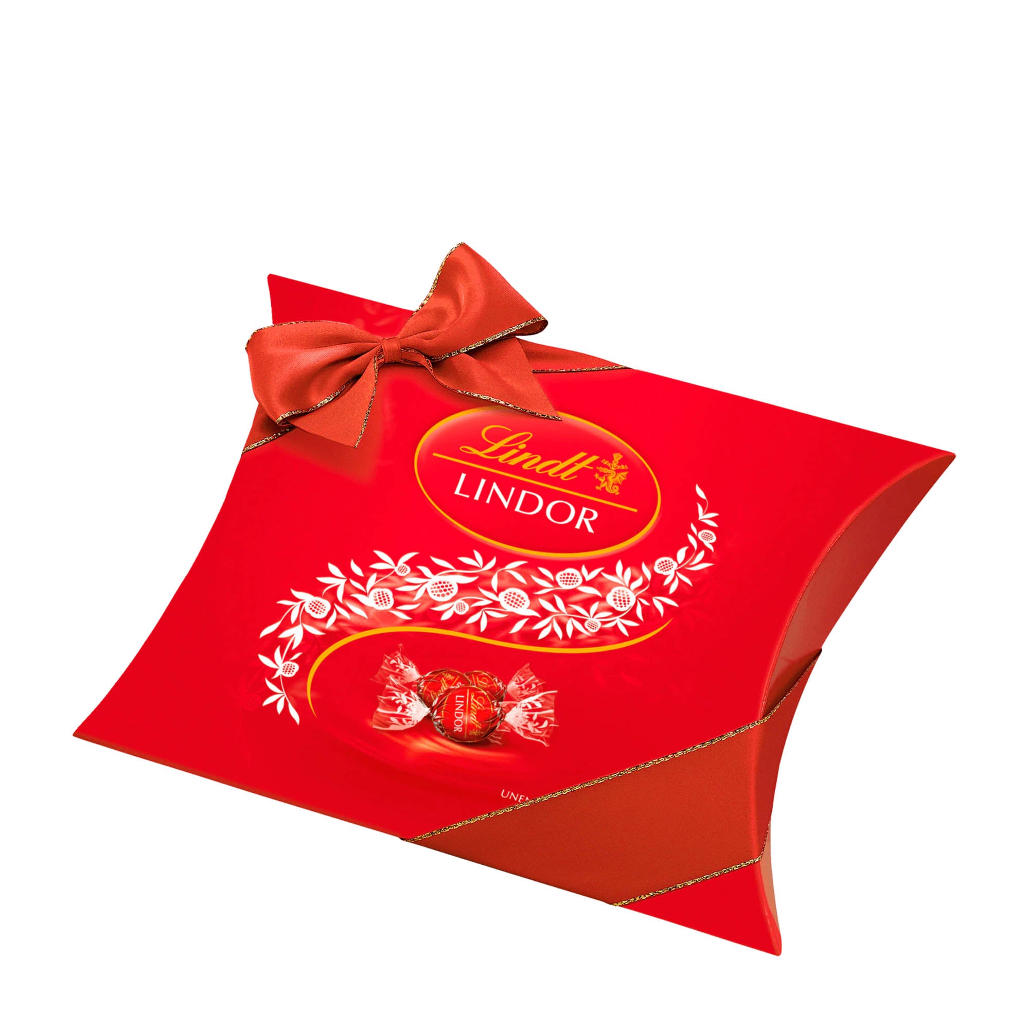 A red Lindt Lindor pillow pack with milk chocolate balls, featuring a decorative ribbon and the Lindt logo on the top.