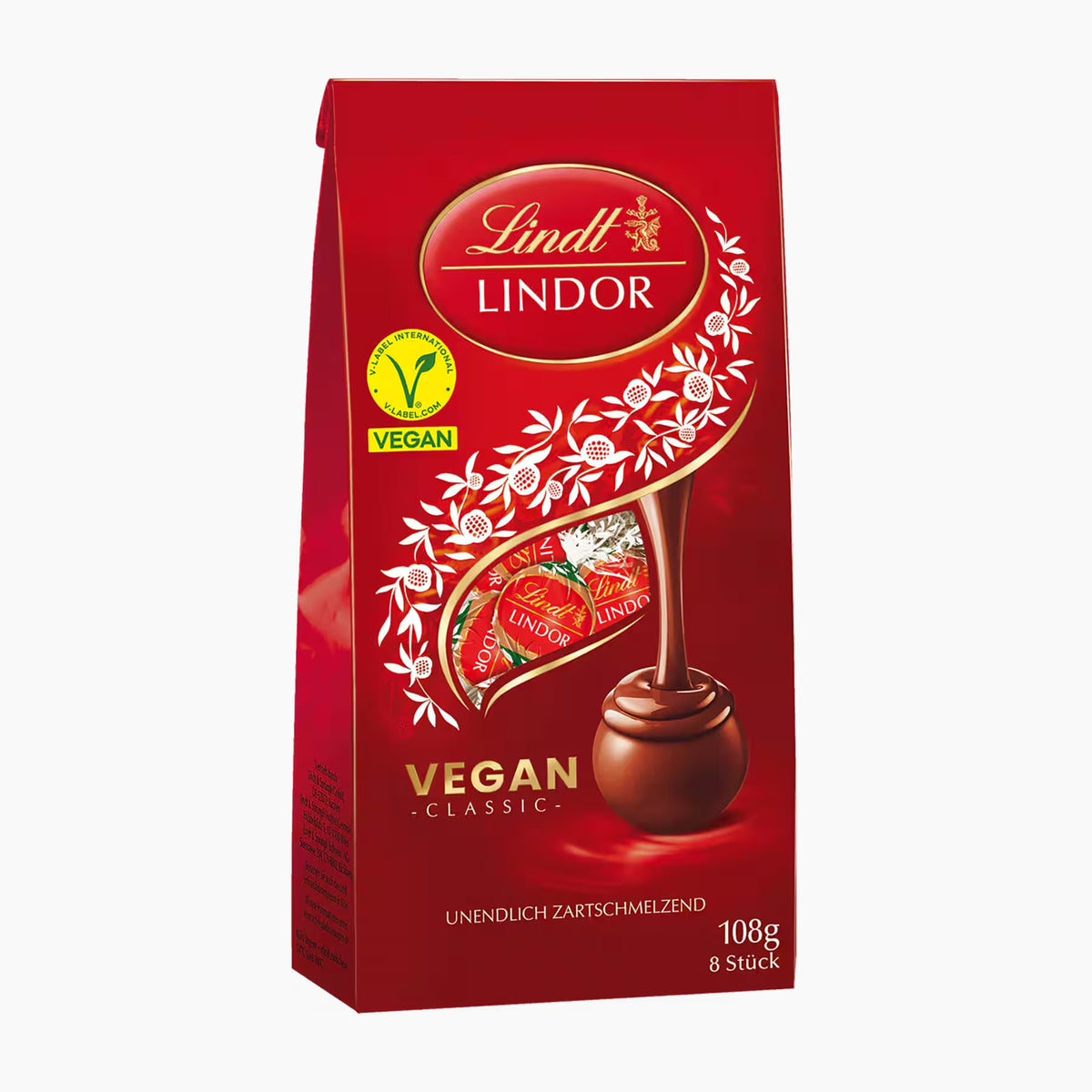 A package of Lindt Lindor Vegan Classic chocolate pralines, 108g, in a red bag with white floral illustrations and a chocolate praline graphic.