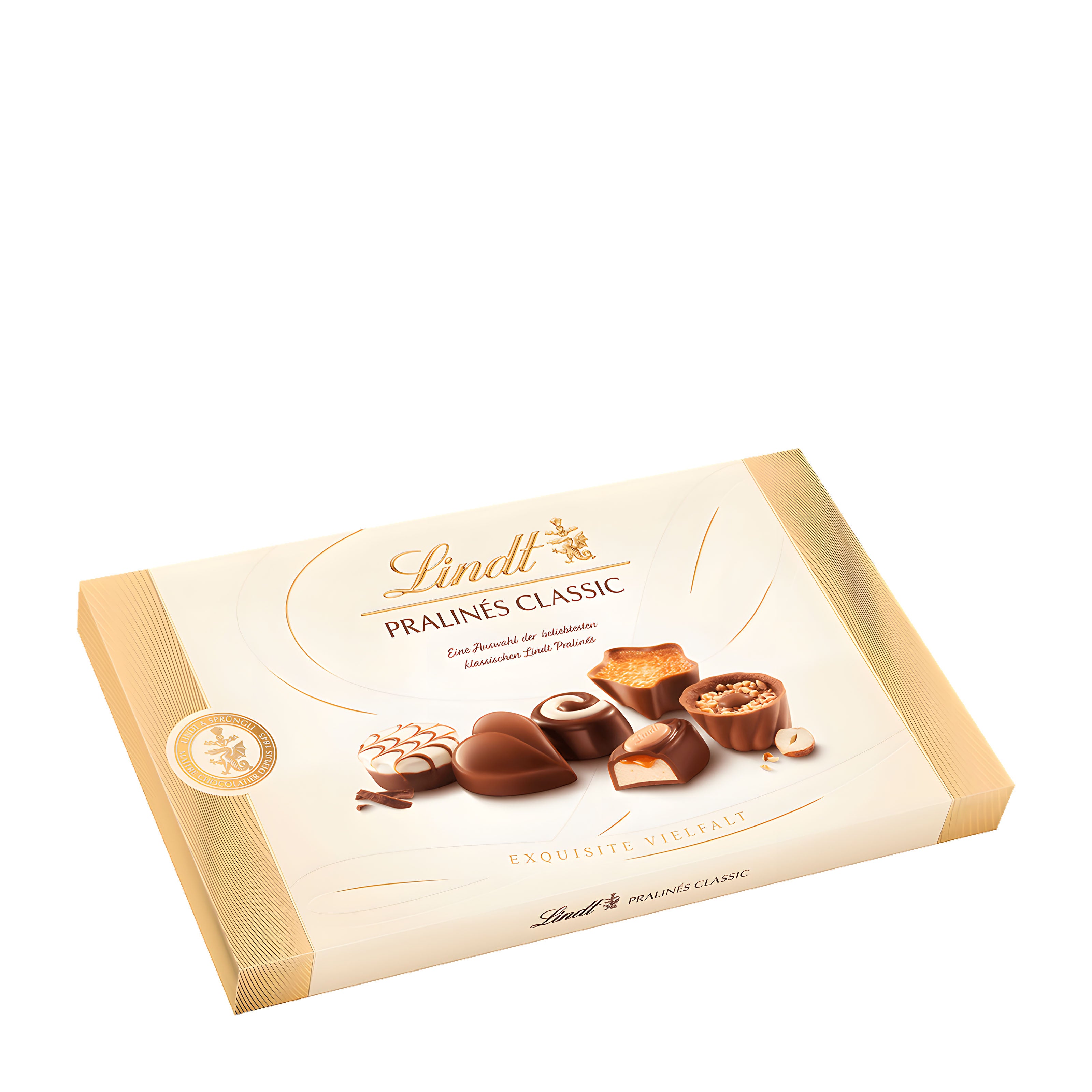 A box of Lindt Classic Pralines with various chocolate candies displayed on the front, including truffles and nut pralines.