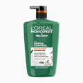 L'Oréal Paris Men Expert Derma Control Anti-Blemish Shower Gel in a green pump bottle with a black cap and orange accent band, on a light gray background.
