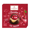 A box of Niederegger Loves Marzipan Cherry pralines, displaying six individually wrapped marzipan pralines with a whole cherry on top, coated in dark chocolate, against a red background with decorative elements.