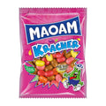 Maoam Kracher candy package with colorful jelly beans on a pink background