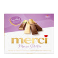 Packaging of Storck merci Mousse Selection with chocolate bars on a white and purple background