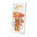 Packaging of Stühmer Milk Chocolate Bar featuring floral designs and a bear illustration.
