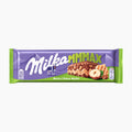 A Milka MMMAX Nutty Choco Wafer milk chocolate bar in its original packaging, featuring a purple and green wrapper with a picture of chocolate, wafer and hazelnut.