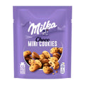 A package of Milka Choco Mini Cookies, showing the cookies with chocolate pieces and the Milka logo on a purple background.