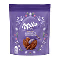 Purple Milka Fine Eggs Alpine Milk pralines packaging with Easter-themed illustrations on a white background