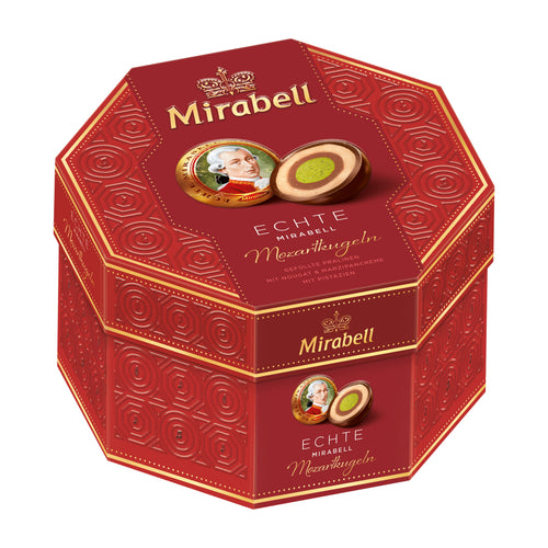 Red hexagonal Mirabell Mozartkugeln pralines box with branding and product images on a white background