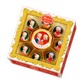A box of Reber Baroque Constanze & Wolfgang Mozart pralines, featuring individually wrapped pralines with images of the two on the packaging.