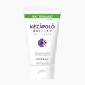 A white squeeze tube of Naturland Lavender Hand Balm with green and purple text and graphics, set against a plain light gray background.