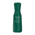 Green bottle of NEQI Volume Victory styling mousse on a white background