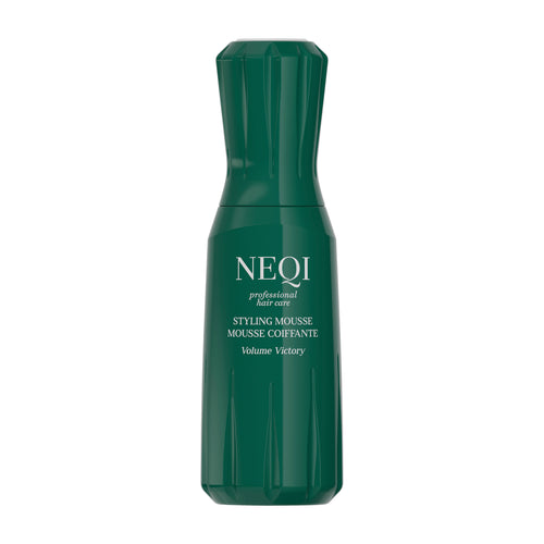 Green bottle of NEQI Volume Victory styling mousse on a white background