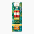Niederegger Master Selection Merry Christmas chocolate pralines gift set in a tall decorative box, featuring Crispy Waffel, Marzipan, Nougat, and Toffee chocolates with festive green, red, and gold holiday packaging.