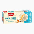 A 100g box of Bergen White Cookies Caramel, Peanut, Coconut on a clean white background. The packaging features a cream-colored background with a red brand logo, blue text, and an illustration of the white, crumbly cookie with a sliced piece showing the caramel and coconut filling.