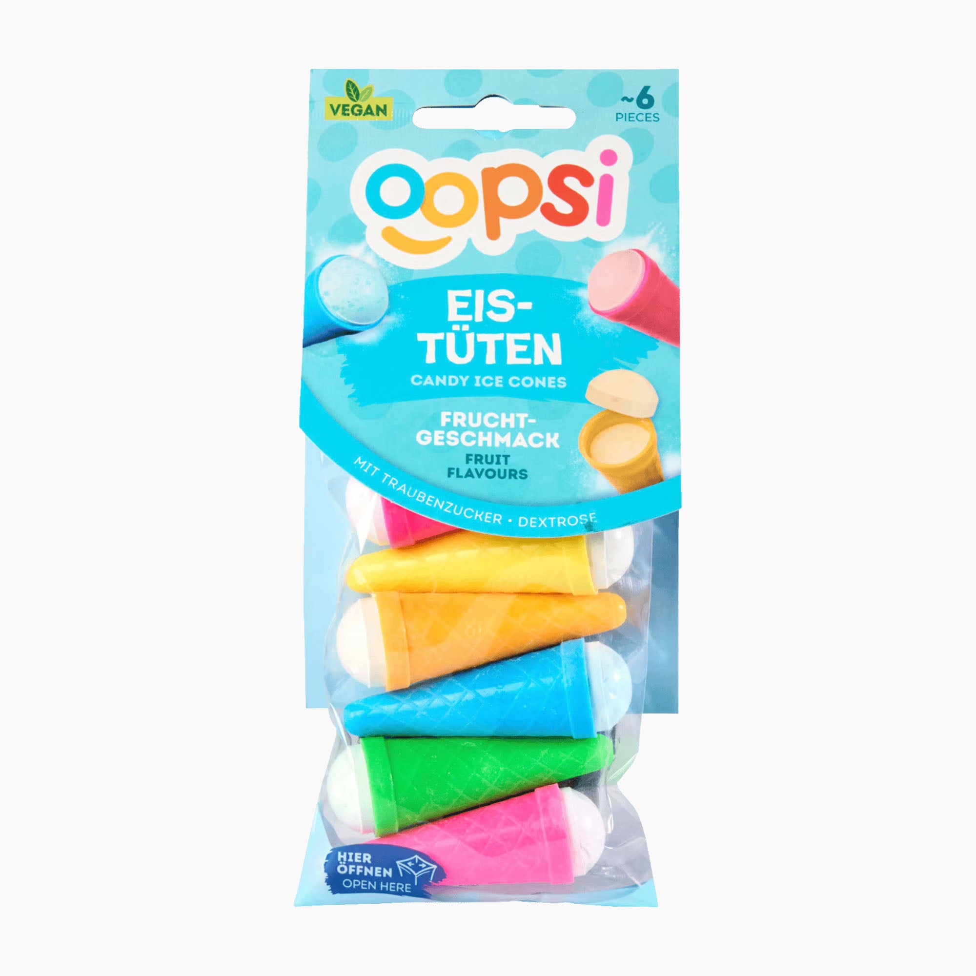 A package of Oopsi fruit-flavored candy ice cones in a clear plastic bag with a blue header card. The package contains six colorful ice cone-shaped candies in pink, yellow, green, blue, and white, and is labeled as vegan.