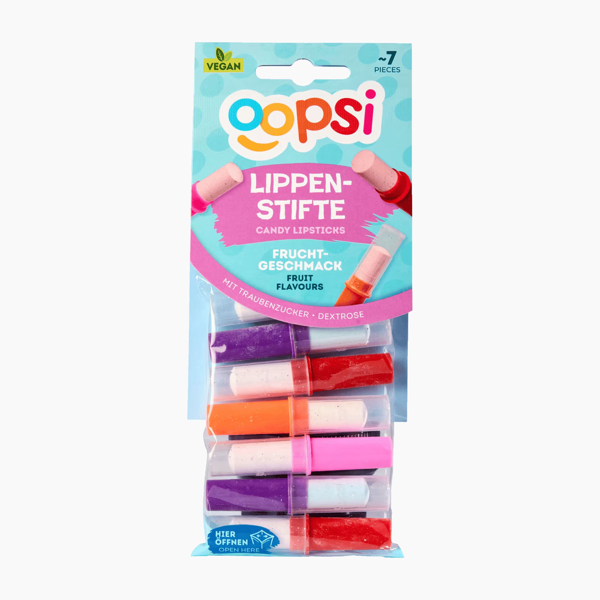A 7-piece set of Oopsi fruit-flavored candy lipsticks in a clear plastic blister pack with a light blue and pink cardboard header. The lipsticks come in purple, red, orange, and pink colors.