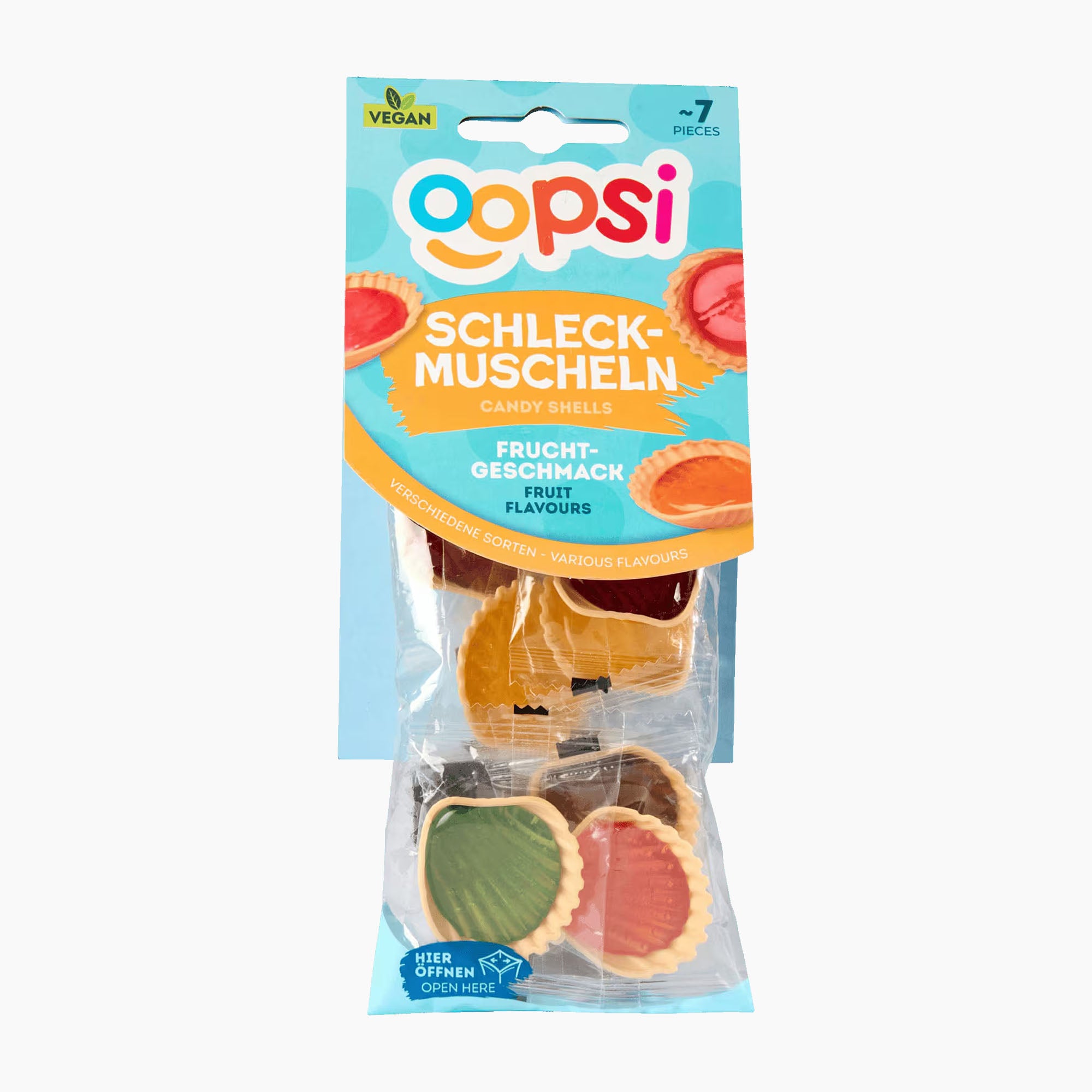 A package of Oopsi fruit-flavored candy shells, containing 7 pieces in a clear plastic bag with a blue and orange cardboard header card.