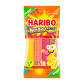 Packaging of Haribo Pasta Basta Sour with colorful fruit gummy strips visible and a cartoon character on the front. The packaging is marked with 'Vegan' and indicates that it is suitable for vegans.