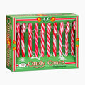 A box of ASBA peppermint candy canes in a green holiday-themed package with red and white striped cones visible through a clear front window.