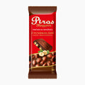 A single Piros Mogyorós premium dark chocolate bar in its red and brown wrapper, featuring a glossy chocolate bar graphic with hazelnuts on a plain white background.