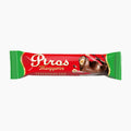 A single wrapped Píros Mogyoros milk chocolate bar on a plain white background. The wrapper is primarily red with green ends, gold decorative trim, white Píros Mogyoros branding, and an illustration of a chocolate-covered nut bar.