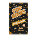 Pop Rocks Cola Flavour popping candy packaging on a black background with gold stars.