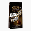A 99g bag of Lindt Lindor Dark 60% Cocoa chocolate pralines on a light gray background.