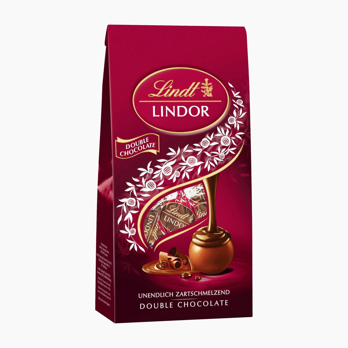 A 100 gpackage of Lindt Lindor Double Chocolate in a deep burgundy stand-up bag with gold and white branding, a decorative swirl, and an illustration of a chocolate praline.