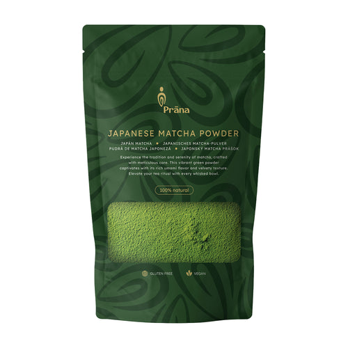 Green package of Prana Japanese Matcha Powder on a white background