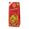 Packaging of Reber Glückskäfer milk chocolate ladybugs, showing a box with red branding and multiple ladybug chocolate pieces.