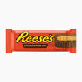 Reese's Peanut Butter Cups in its signature orange wrapper, featuring the yellow Reese's logo and an image of a peanut butter cup on the right side.