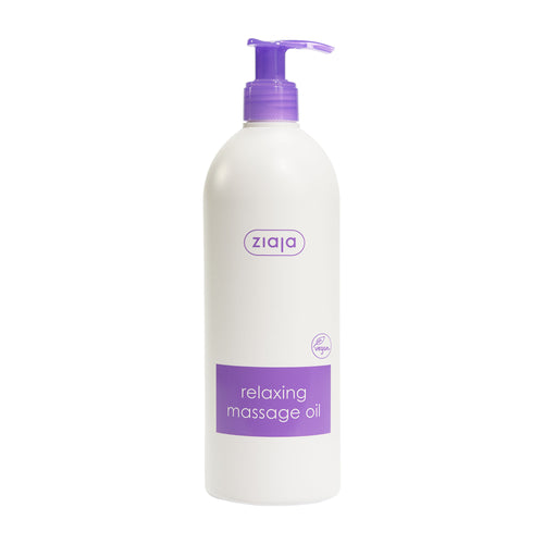 Bottle of Ziaja Relaxing Massage Oil with purple pump and label on a white background