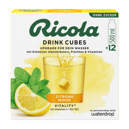 Ricola Drink Cubes packaging with lemon, mint, and glass of drink on a white background