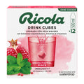 Ricola Drink Cubes packaging with pomegranate and mint, featuring a glass of red drink.