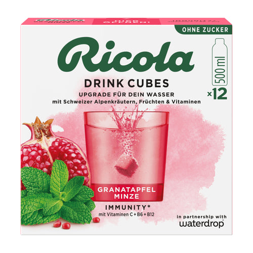 Ricola Drink Cubes packaging with pomegranate and mint, featuring a glass of red drink.