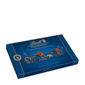 Blue box of Lindt Royal Pralines with decorative elements on a white background