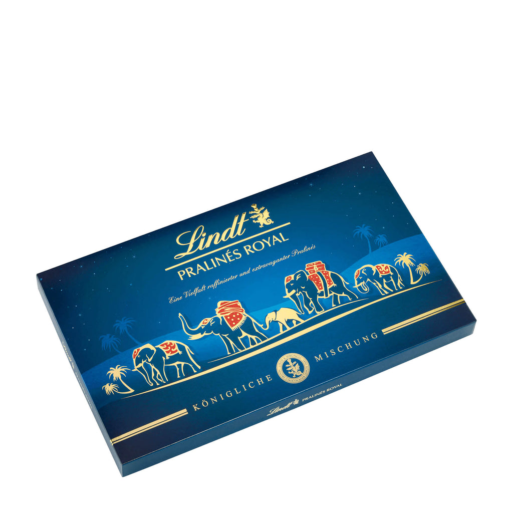 A Lindt Royal Pralines assortment box with a vibrant blue background featuring gold accents and an illustration of animals alongside the Lindt logo.