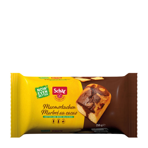 Packaged cocoa marble cake with Schar branding on a white background